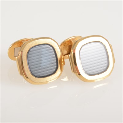 Lot 697 - Patek Philippe - a pair of Nautilus design cufflinks