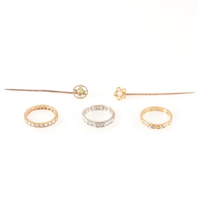 Lot 195 - Two stick pins and three eternity rings.