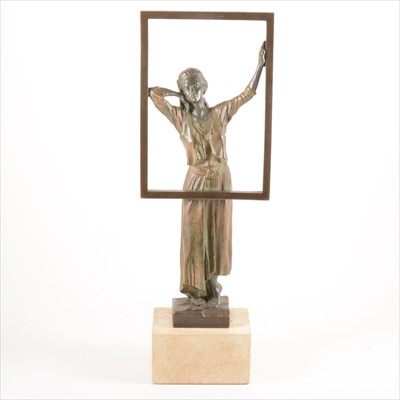 Lot 282 - A contemporary bronze-effect sculpture of a woman at a window, signed Miro, 1996