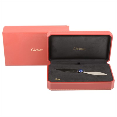 Lot 704 - Cartier - a propeller design paper knife.