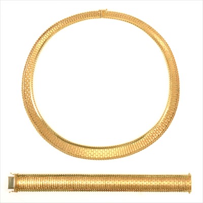 Lot 680A - Carl Bucherer - a yellow metal necklace and bracelet suite.