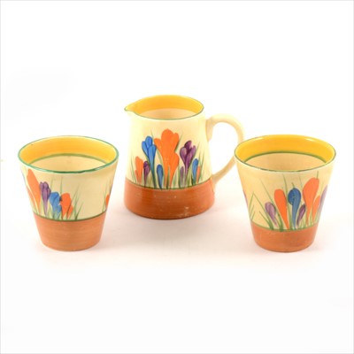Lot 24 - Clarice Cliff - two Crocus design pair of conical lemonade beakers 7cm, similar jug 8cm.