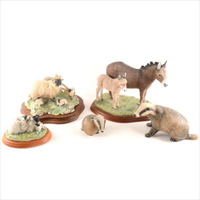 Lot 79 - Border Fine Arts, "Donkey Jenny and Foal", plus two sheep groups; and two Purbeck Pottery badgers.
