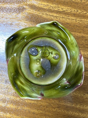 Lot 64 - Two lobed dishes designed by Dr Christopher Dresser for Linthorpe Art Pottery, a Sea-form teapot, and another vase