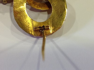 Lot 68 - A mid 19th Century yellow metal brooch, in the form of a coiled snake with simulated scales