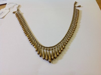Lot 106 - A late 19th Century yellow metal fringe necklace.