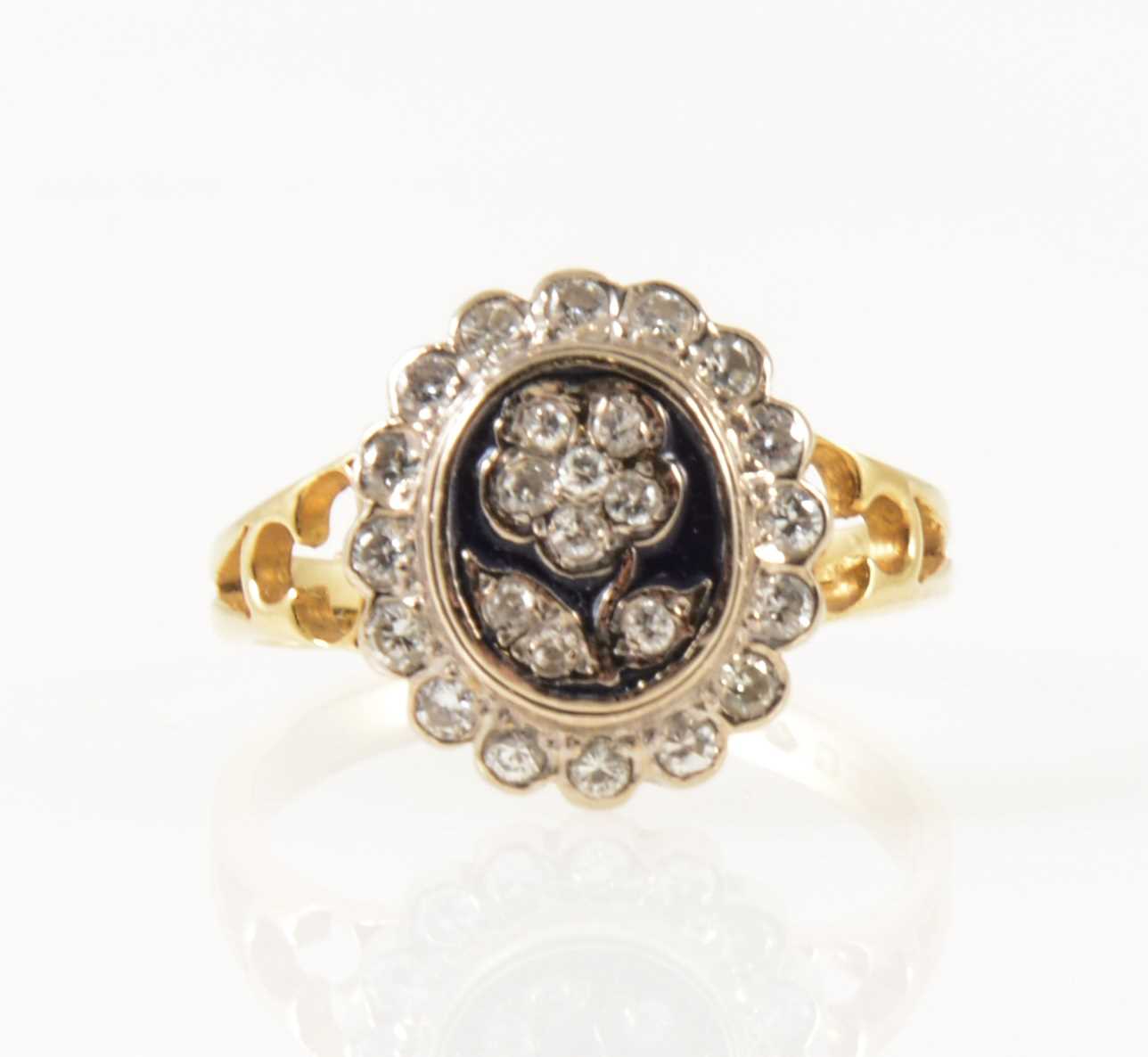 Lot 36 - A diamond and enamel dress ring.