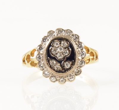 Lot 36 - A diamond and enamel dress ring.