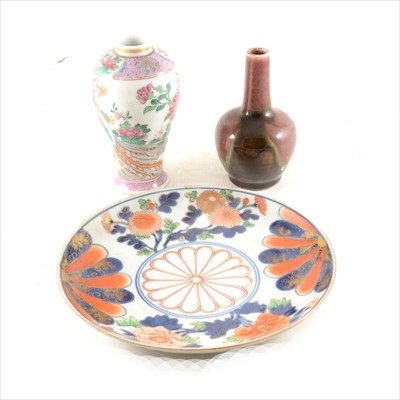 Lot 25 - An Arita style porcelain plate, a Chinese famille rose vase, and a high fired vase