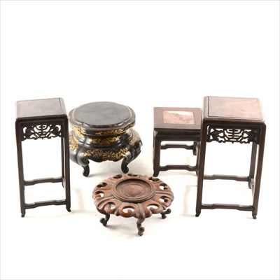 Lot 195 - A Chinese carved hardwood lotus leaf double stand, and other Chinese stands