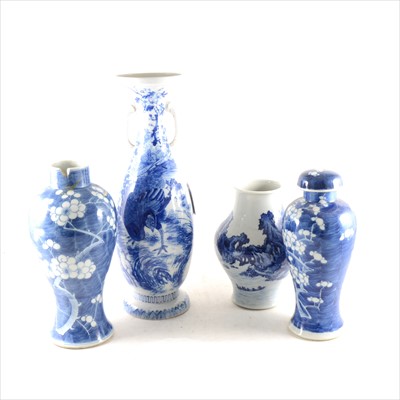 Lot 24 - A Chinese blue and white vase, a similar vase with matching cover, an two Japanese vases