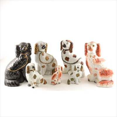 Lot 39 - A collection of twelve Staffordshire King Charles Spaniels