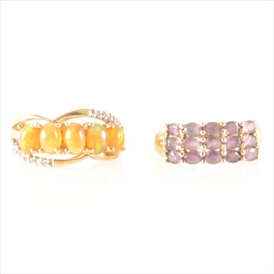 Lot 199 - An opal five stone ring and a "Tunduru" sapphire half hoop ring.