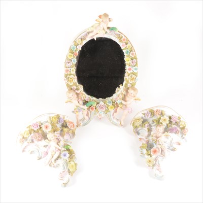 Lot 27 - Dresden style porcelain table mirror and similar pair of wall brackets
