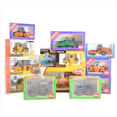 Lot 211 - Seventeen die-cast model construction vehicles and tractors, mostly Siku and Joal, all boxed.