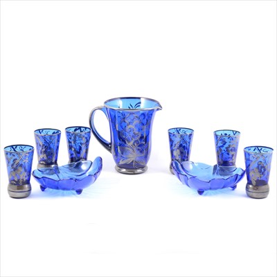Lot 28 - A 1920s blue glass lemonade jug and set of six tumblers, silvered overlay, two modern blue glass dishes.