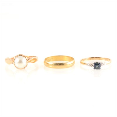 Lot 196 - An 18 carat gold wedding band, cultured pearl ring, sapphire ring.