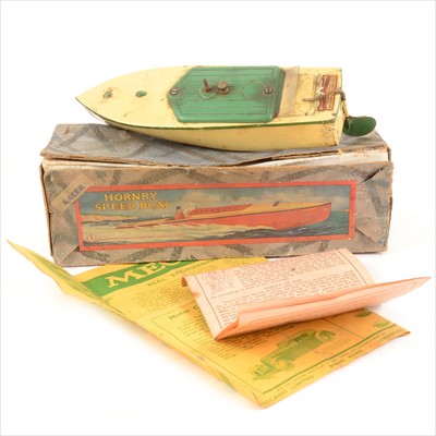 Lot 450 - Hornby tin-plate clock-work model speed boat 'Racer' no.1, cream and green body, with key and booklets, original box.