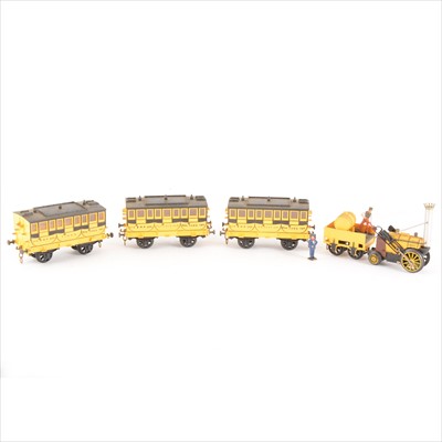 Lot 60 - Tri-ang OO gauge 'Stephenson's Rocket' locomotive, R651 loco, R652 wagon, and three R621 passenger coaches, unboxed.
