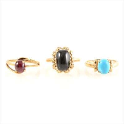 Lot 213 - Three cabochon cut gemset rings.