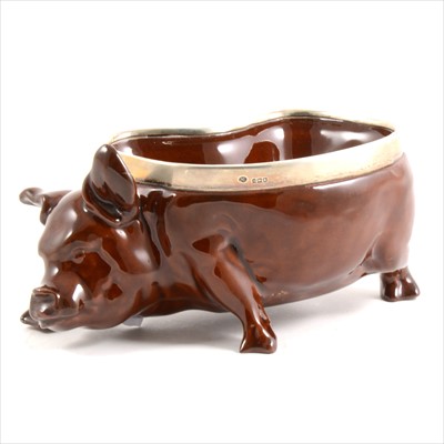 Lot 10 - A Royal Doulton treacle glazed pig dish modelled by Charles Noke.