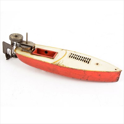 Lot 424 - Tin-plate speedboat, red and cream body, with clock-work attached motor to back, 28cm.