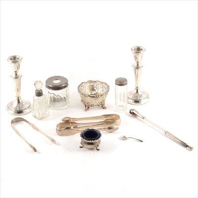 Lot 169 - A pair of silver filled candlesticks, salt, three pairs of sugar tongs, etc