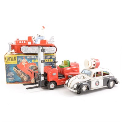 Lot 429 - Tin-plate and plastic toys; three including Modern Toys Japan W Police Beatle, 26cm, Modern Toys S-1002 fork-lift, 29cm, and a Lincoln International Bulldozer, boxed.