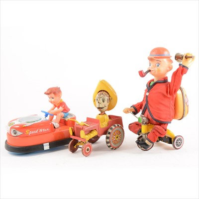 Lot 428 - Tin-plate and plastic toys; three including Bandai Japan 'Cycling Daddy' battery operated toy, 27cm, Speed Star dodgem car, 20cm, and a clock-work go-kart and boy toy, 15cm.