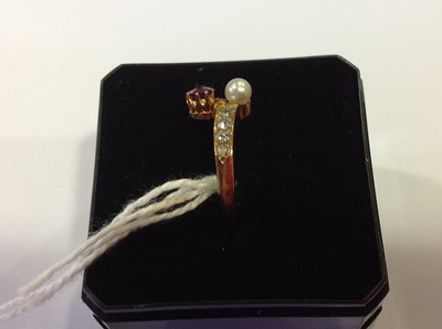 Lot 29 - A pearl and diamond crossover ring.