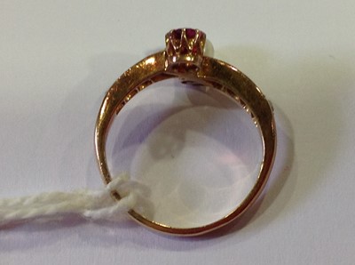 Lot 29 - A pearl and diamond crossover ring.