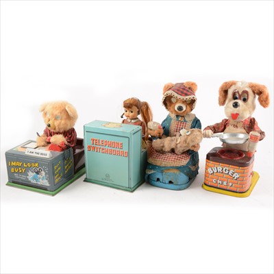 Lot 415 - Eleven Japanese battery operated tin-plate and plush toys; including telephone switchboard, 'I May Look Busy' and other.