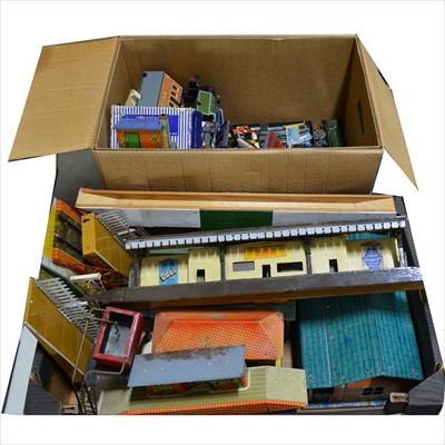 Lot 42 - Two boxes of model railway accessories, parts, spares, tin-plate O gauge buildings, die-cast trains, track-side scenery and others.