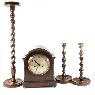 Lot 159 - An oak cased mantel clock, pair of oak barleytwist candlesticks, and a smoker's companion