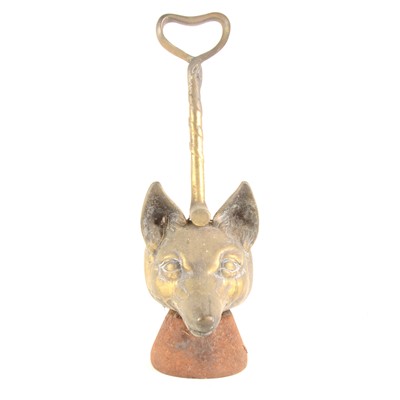 Lot 141 - A cast brass doorstop, modelled as a fox head and riding crop