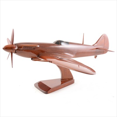 Lot 303 - Walnut model of a Spitfire aircraft, lacquered with inlay, moving propellers, removable wings, on stand, 43cm length, 49cm wing span.