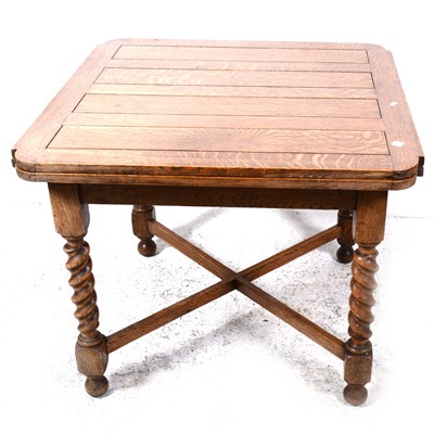 Lot 111 - An oak draw-leaf dining table, and four dining chairs