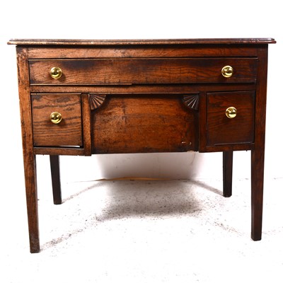 Lot 88 - A Georgian oak lowboy, adapted