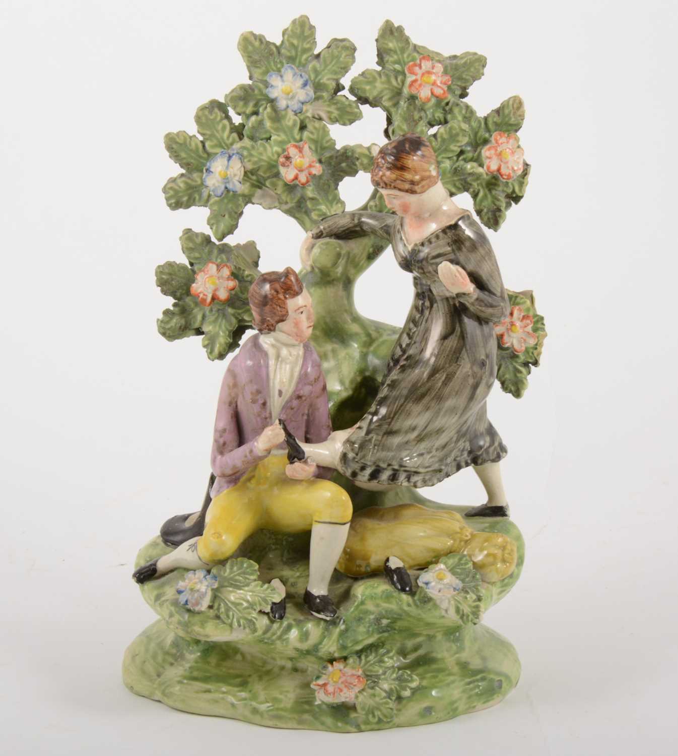 Lot 4 - A Staffordshire pearl glazed earthenware bocage group, circa 1820