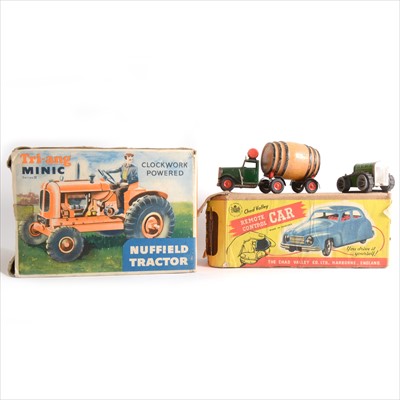 Lot 444 - Tri-ang Minic clockwork powered Nuffield Tractor, boxed, Tri-ang large Excavator, boxed etc
