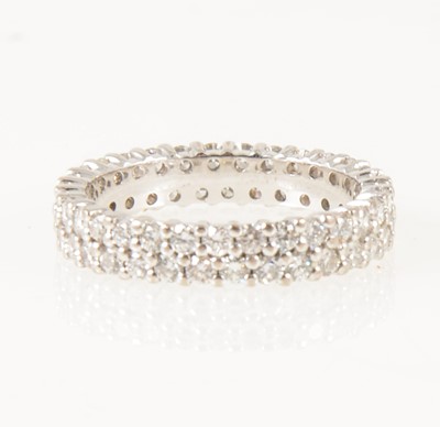 Lot 13 - A diamond two row full eternity ring,.