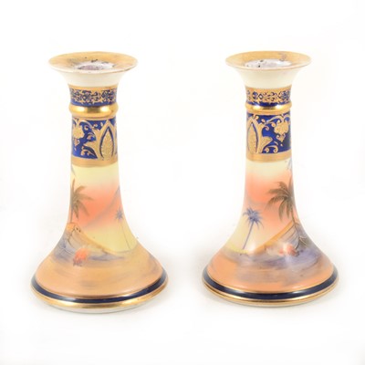 Lot 1002 - A pair of Noritake porcelain candlesticks