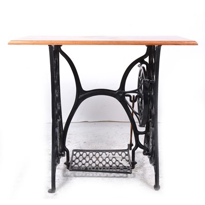 Lot 31 - A sidetable, incorporating the base of a Singer treadle sewing machine