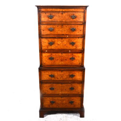 Lot 105 - A reproduction walnut finish chest on chest