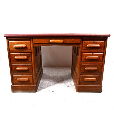 Lot 110 - An oak twin pedestal desk