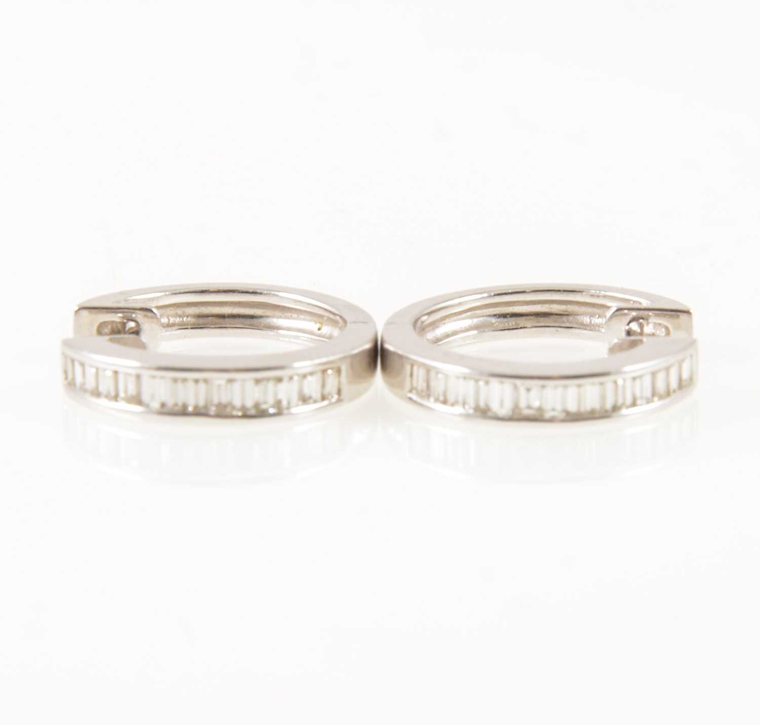 Lot 53 - A pair of diamond hoop earrings.