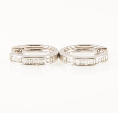 Lot 53 - A pair of diamond hoop earrings.