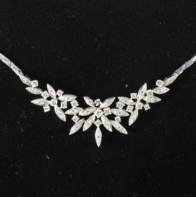 Lot 103 - A diamond set necklace.