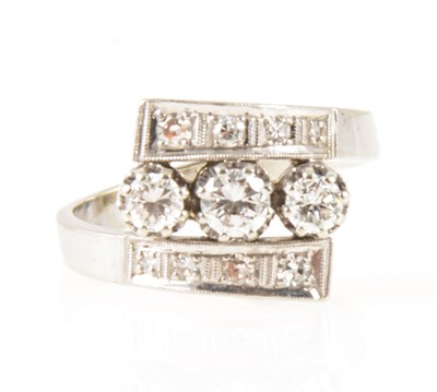 Lot 8 - A diamond three row ring.