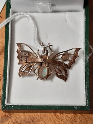 Lot 105 - An opal butterfly pendant.